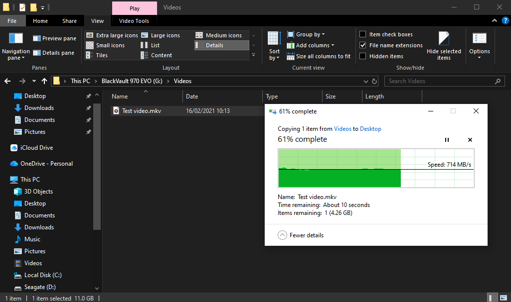 File Explorer in dark mode in the Videos folder of the Mac drive BlackVault 970 EVO (G:). A Windows copy dialog shows Test video.mkv (11.0 GB) being copied from Videos to Desktop at 714 MB/s, 61% complete.